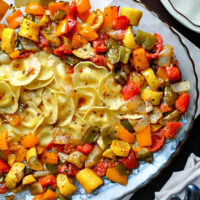 ravioli with roasted vegetables sweet peppers onion plum tomato summer squash roasted in a balsamic olive oil herb dressing