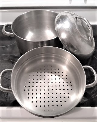 5 quart stainless steel saucepan with steaming basket and lid