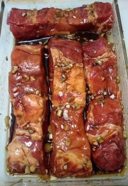 boneless pork ribs rolled in marinade