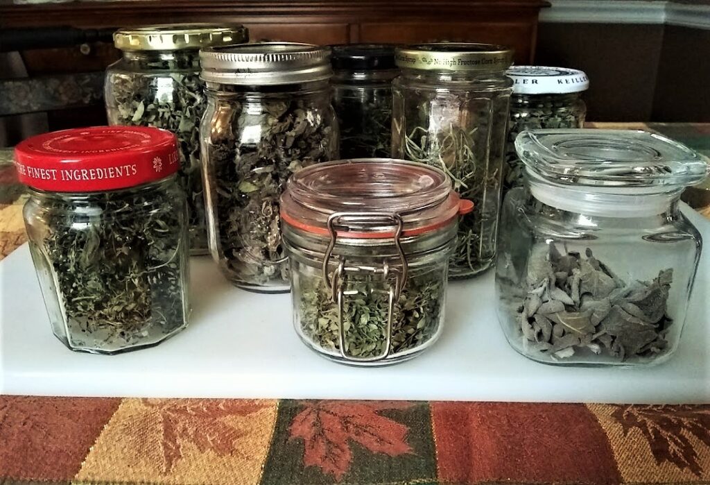 several bottles of homegrown dried herbs