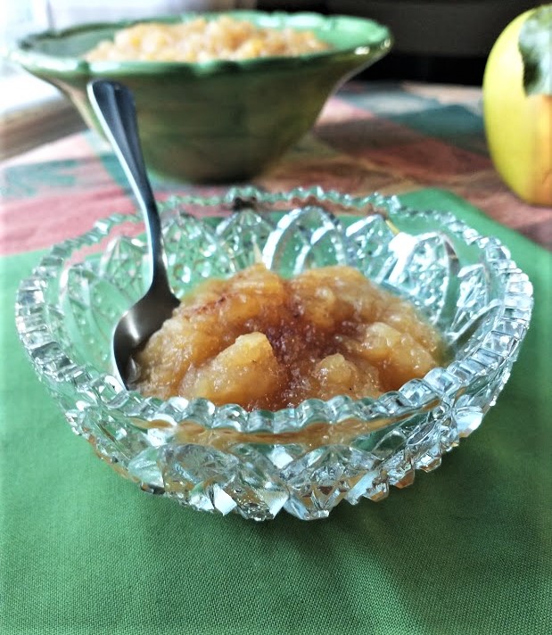 small cut glass bowl with applesauce maple syrup and nutmeg