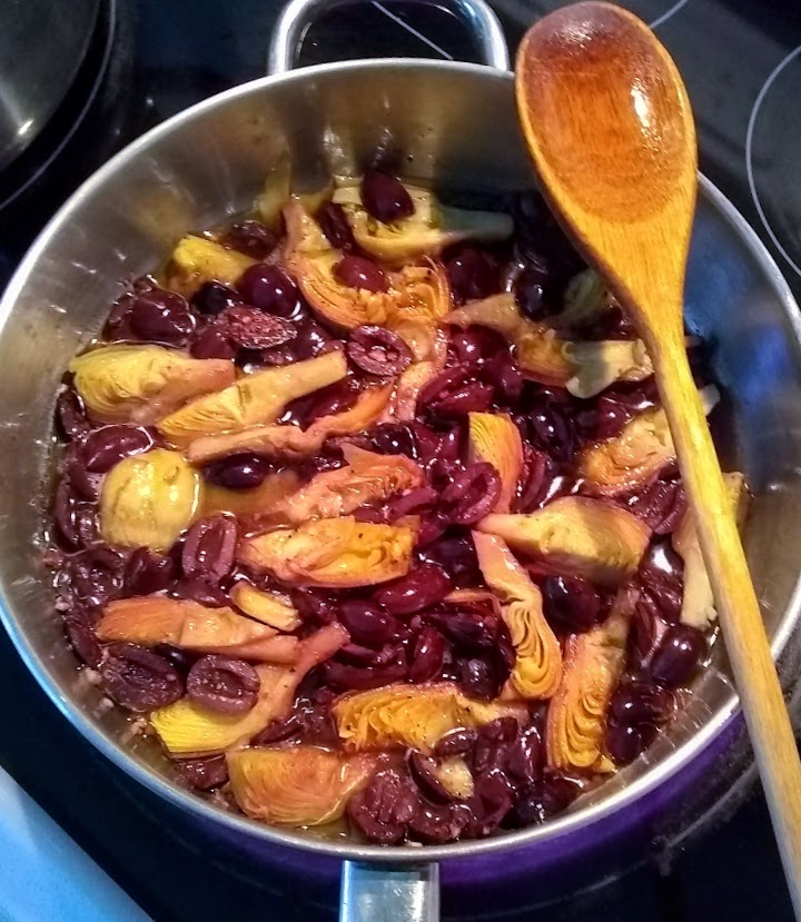 olives and artichoke hears after sauteing in olive oil and garlic