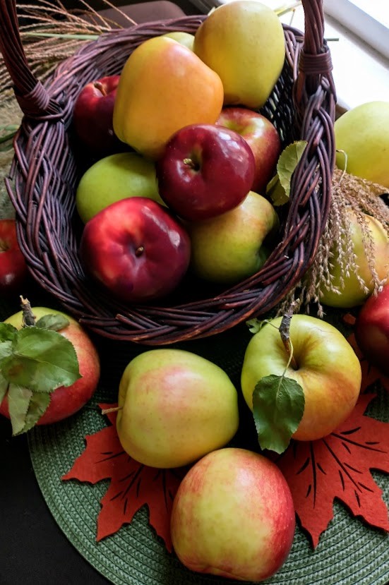 a variety of apples in a basket