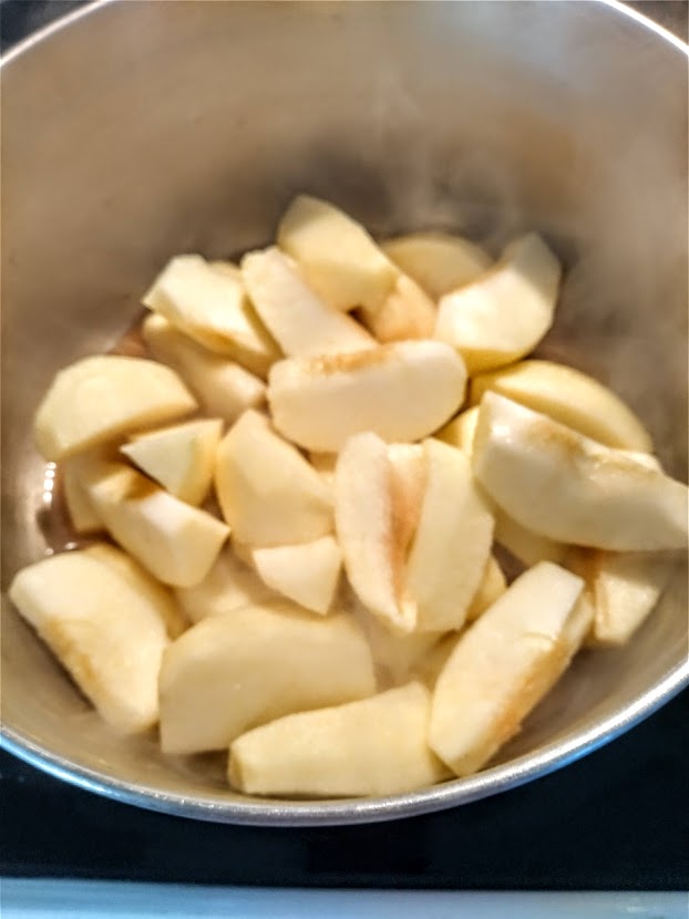 apples in saucepan with cider