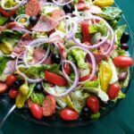antipasto salad with traditional italian ingredients with greens