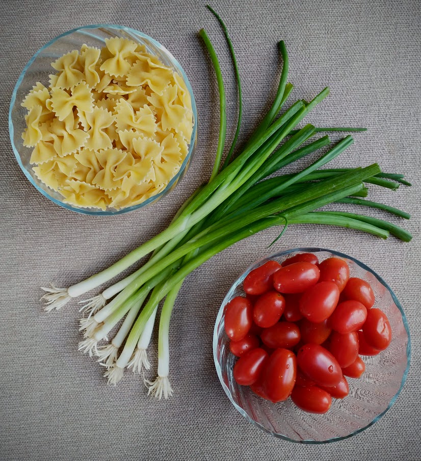 kids meal ingredients grape tomatoes green onion and bowtie pasta