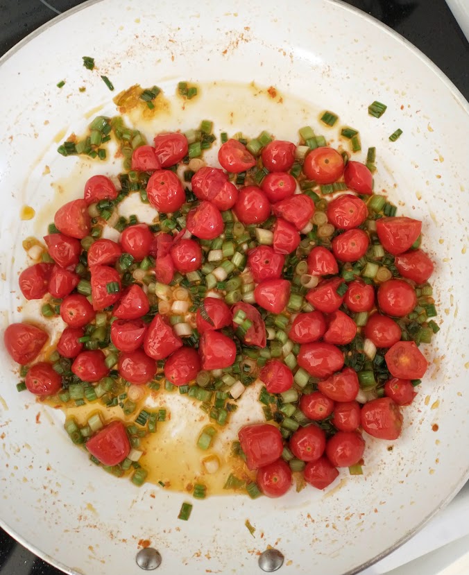 kids meal grape tomatoes and green onions done in skillet