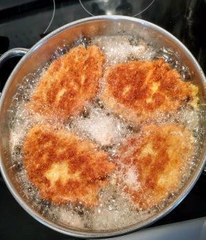 golden brown cutlets in a skillet