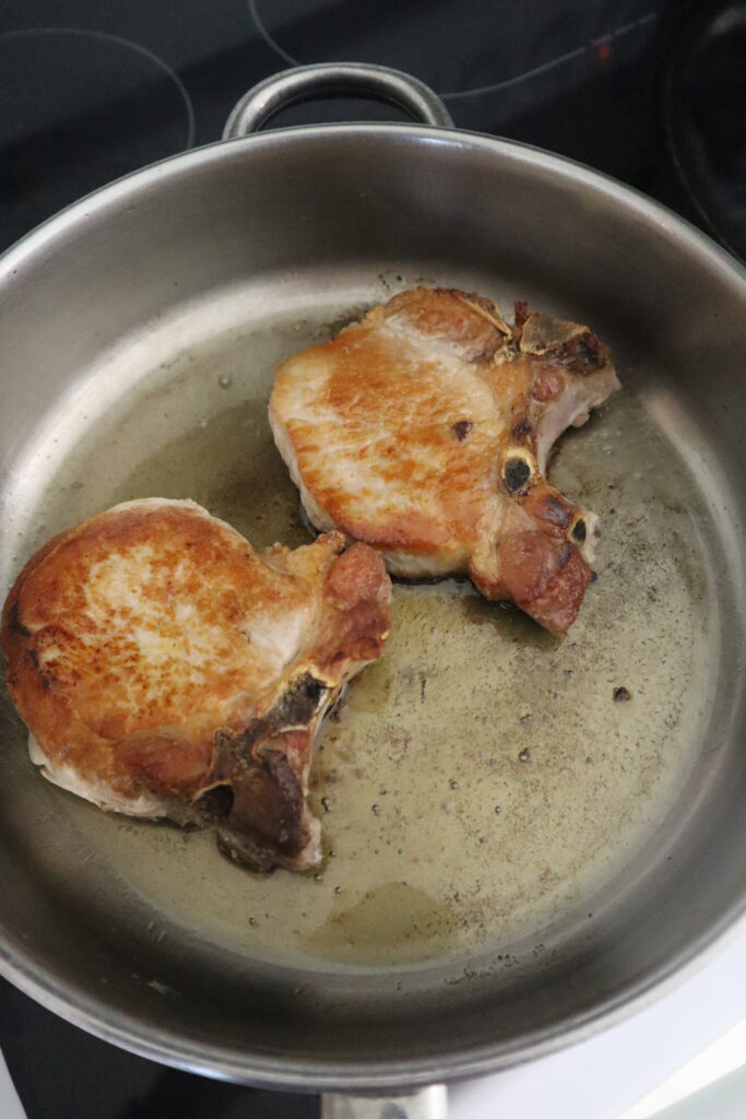 center cut  pork chops searing in skillet