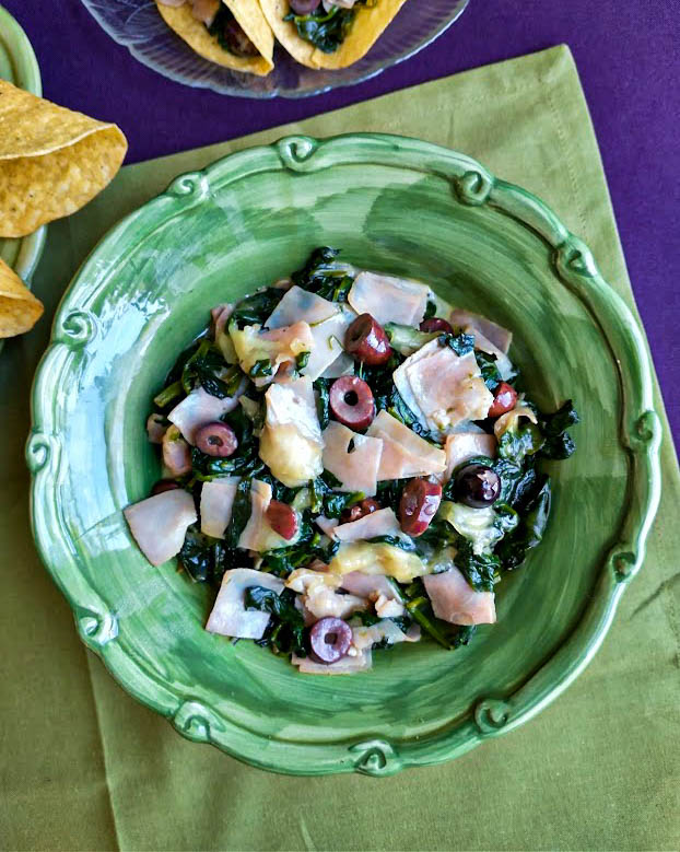 spinach saute for tacos in serving bowl