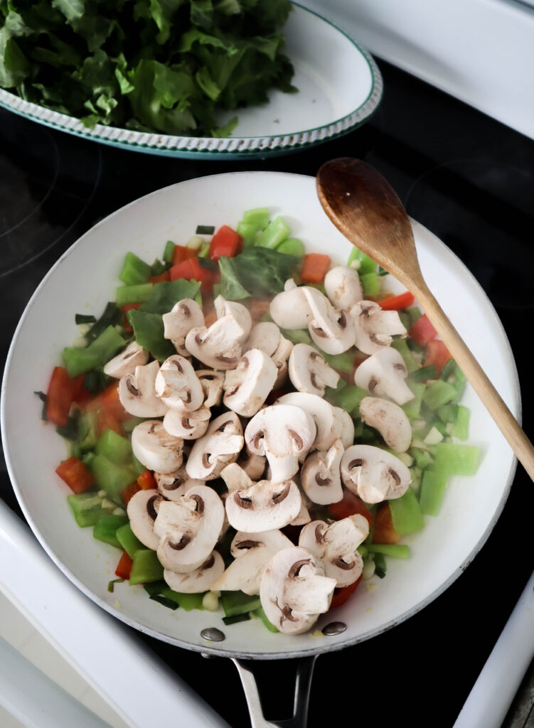 mushrooms added to the vegetable saute in the skillet