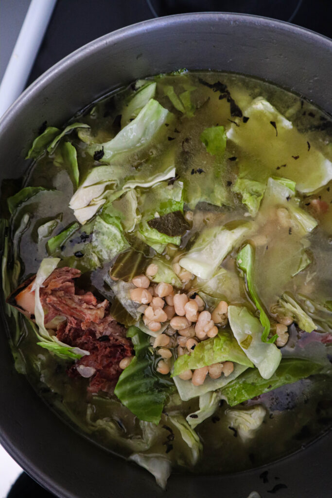 add cabbage to other cooked ingredients in stockpot