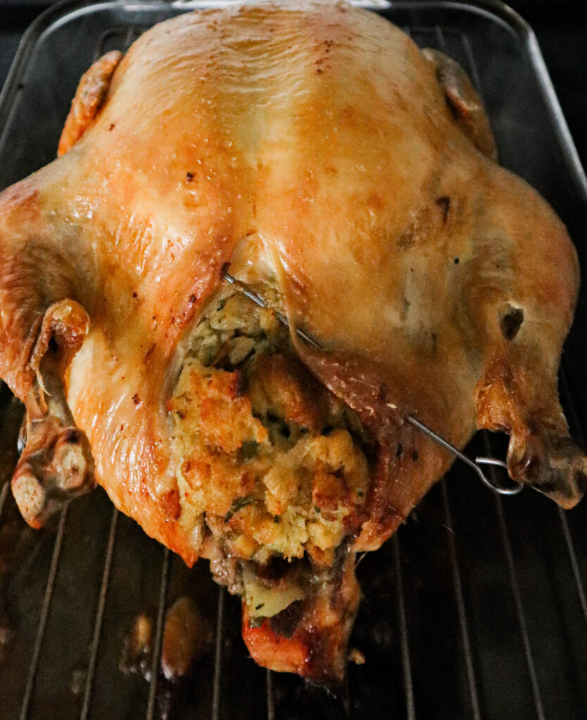 close up of a dry roasted chicken just out of the oven to demonstrate how to determine doneness