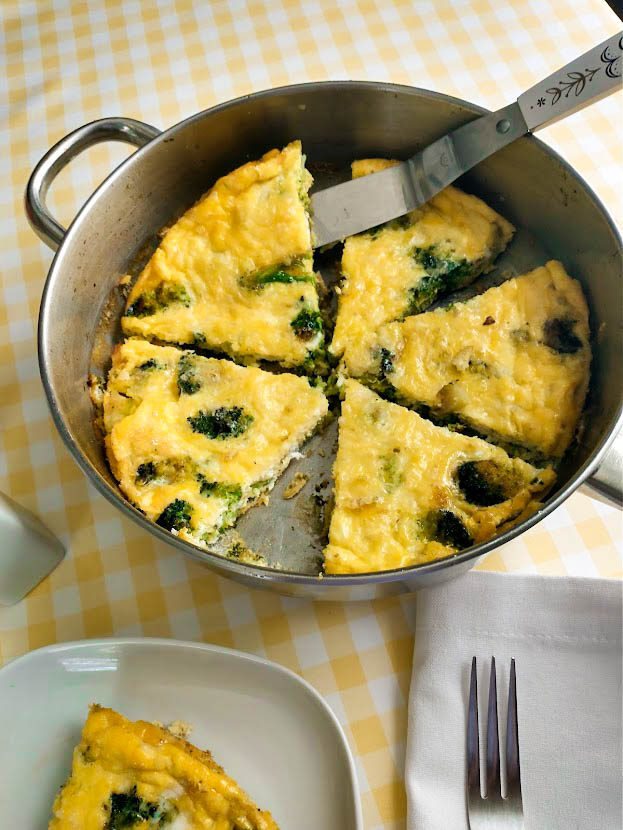 broccoli frittata served at the table out of the skillet