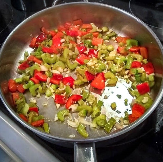 scallions and garlic added to the celery and red pepper in skillet