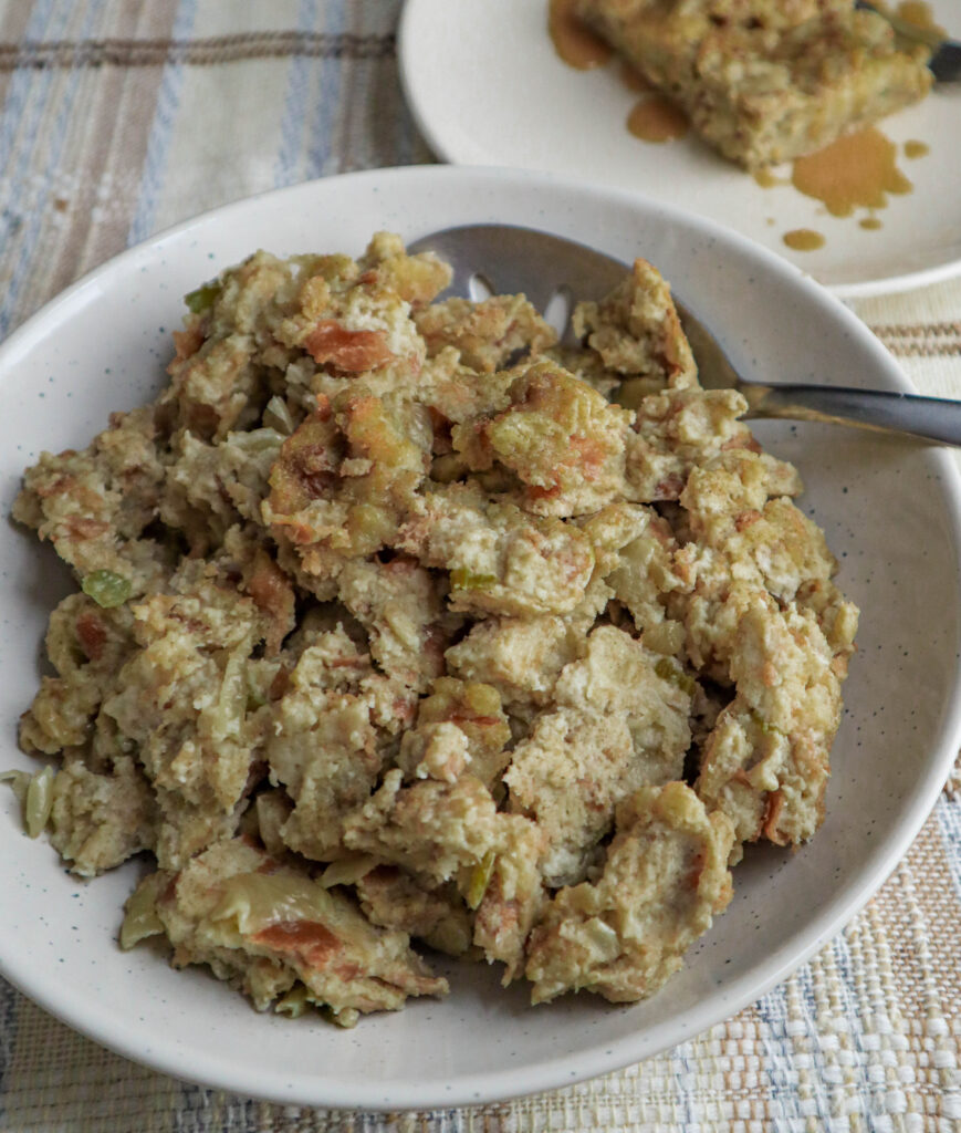 a bowl of savory bread stuffing served at the table