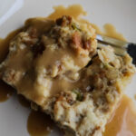 a single serving of bread stuffing with gravy served
