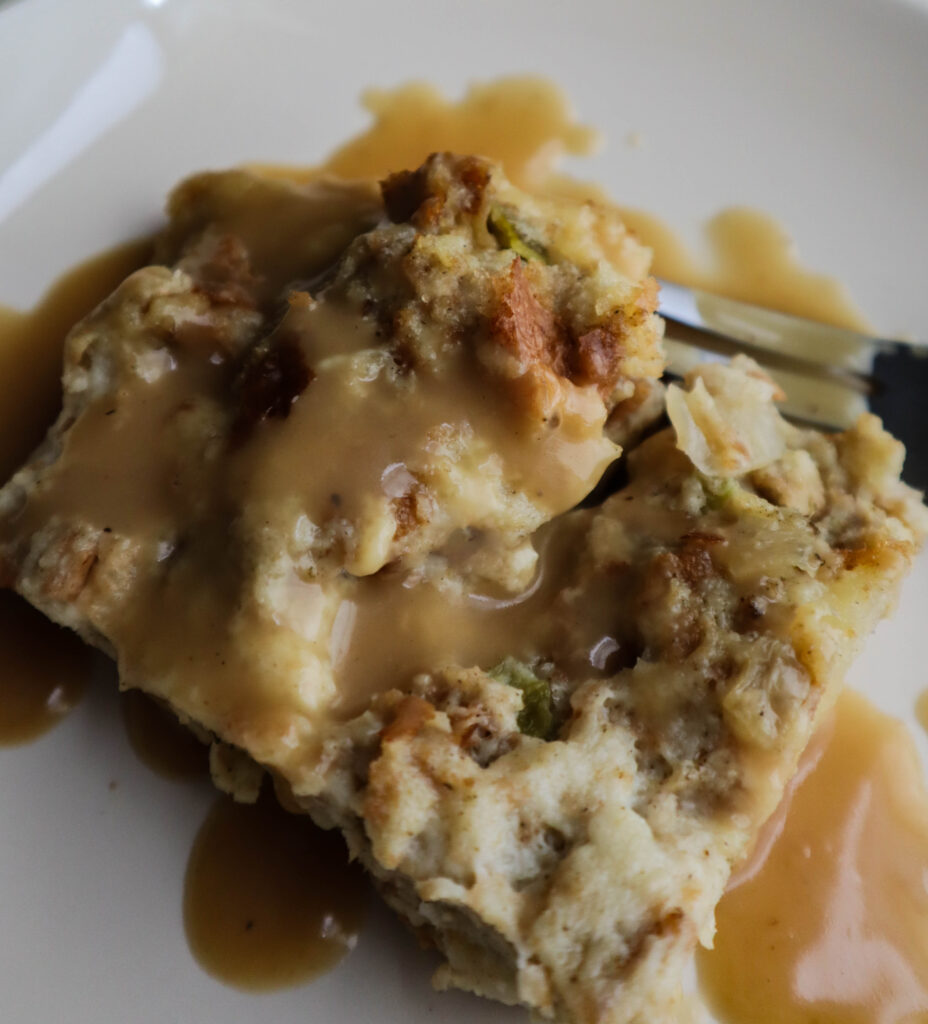 a single serving of bread stuffing with gravy served