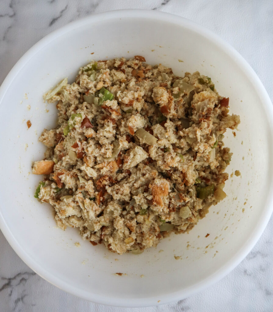 uncooked stuffing in a large white bowl