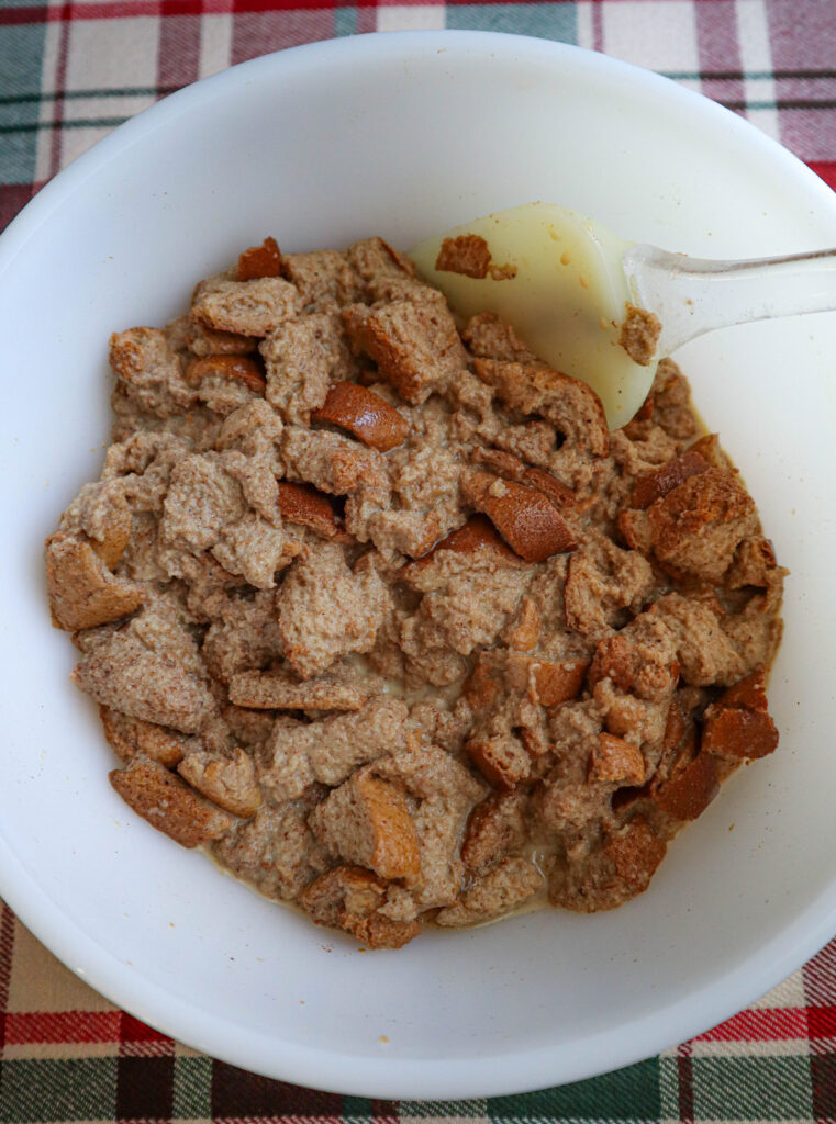 bowl of bread cubes with liquid ingredients added