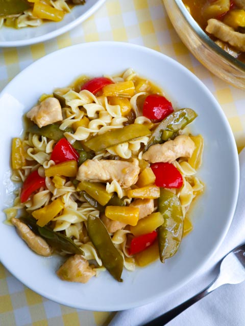 chicken pineapple stir fry served on a white plate