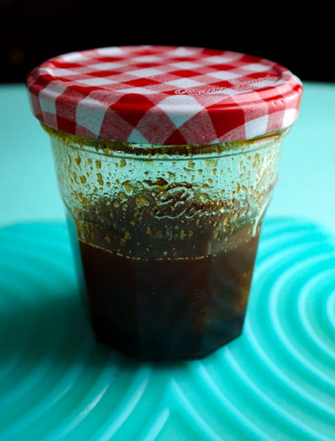 marinade ingredients shaken up in a glass bottle