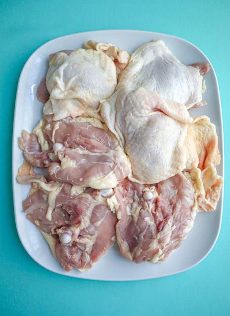 6 chicken thighs before they are trimmed of fat and excess skin