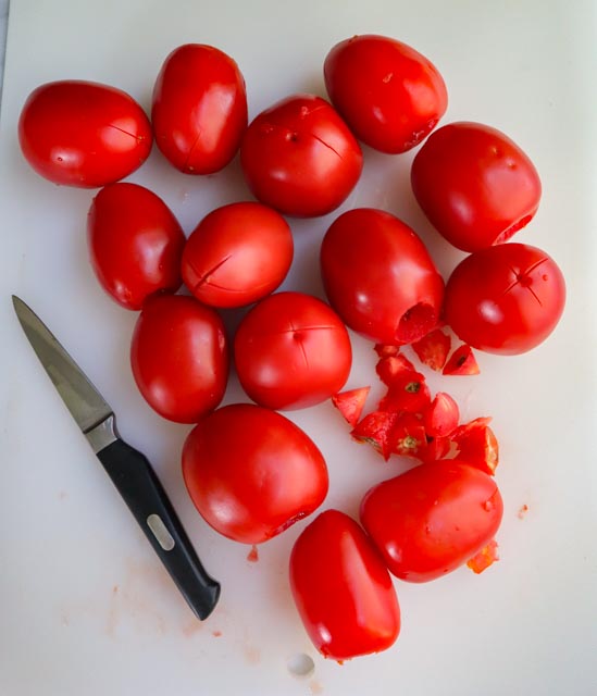 plum tomatoes cored and scored