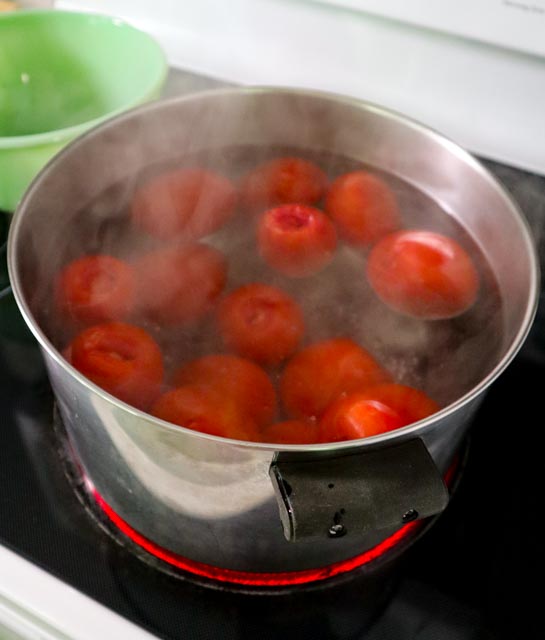 plum tomatoes boiling on the stove 