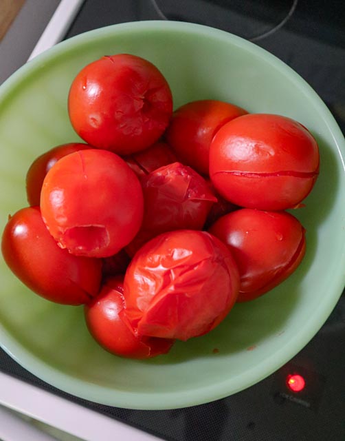 a bowl of boiled plum tomatoes