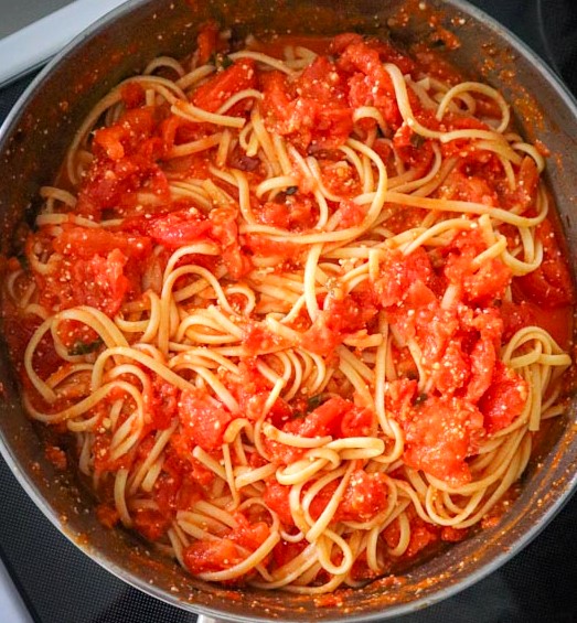 fresh tomato sauce with linguini mixed in still in the skillet