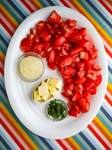 chopped tomatoes sliced butter chopped basil and grated cheese