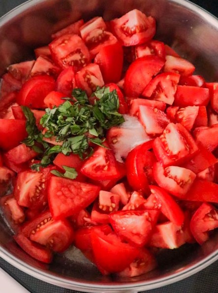 add chopped tomatoes to the butter in the skillet