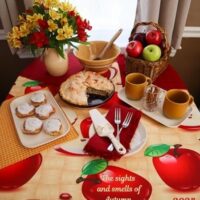 september dinner table with apples and cinnamon in golds and reds